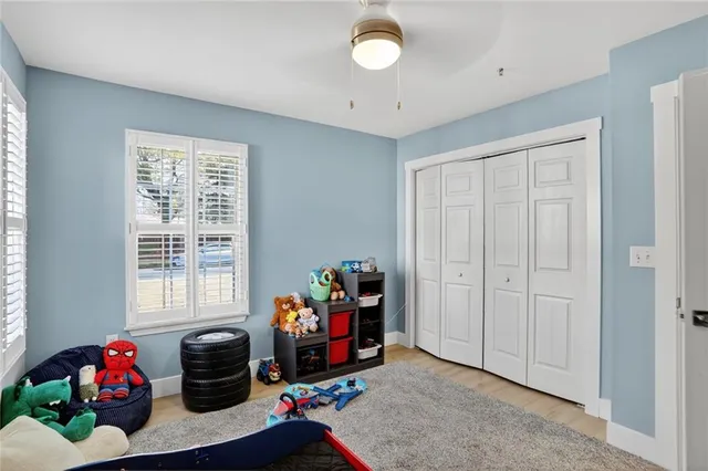 a bedroom with furniture and a window