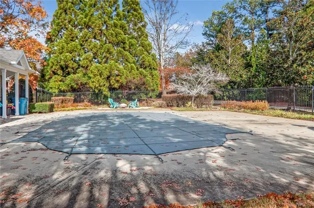 a view of yard with large trees