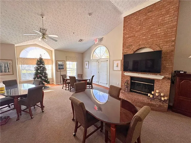 a view of a livingroom with furniture window and wooden floor