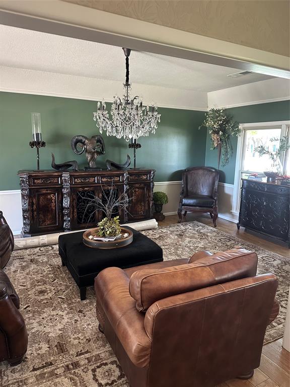 505 High Road Coleman, TX 76834 - Photo 11 of 38 a living room with furniture and a chandelier