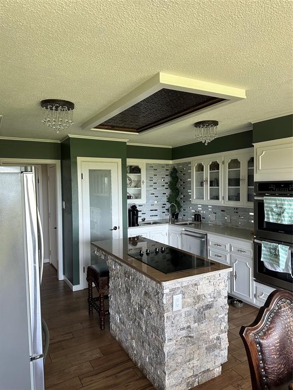 505 High Road Coleman, TX 76834 - Photo 16 of 38 a large living room with stainless steel appliances kitchen island granite countertop furniture and a large window