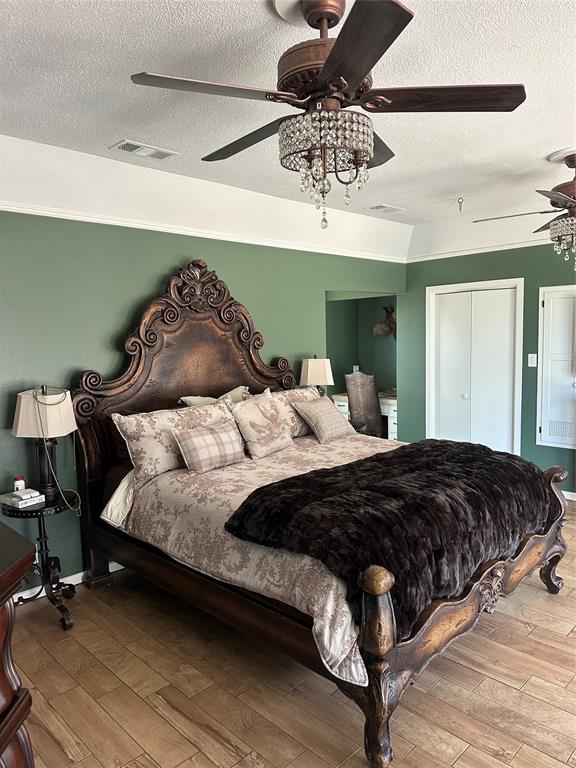 505 High Road Coleman, TX 76834 - Photo 18 of 38 a bedroom with a bed lamp and fan