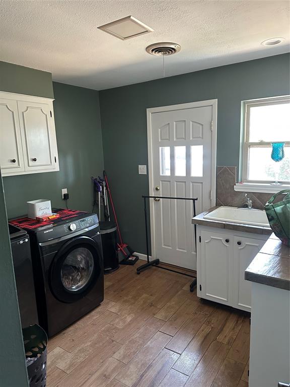 505 High Road Coleman, TX 76834 - Photo 26 of 38 a utility room with closet dryer and washer