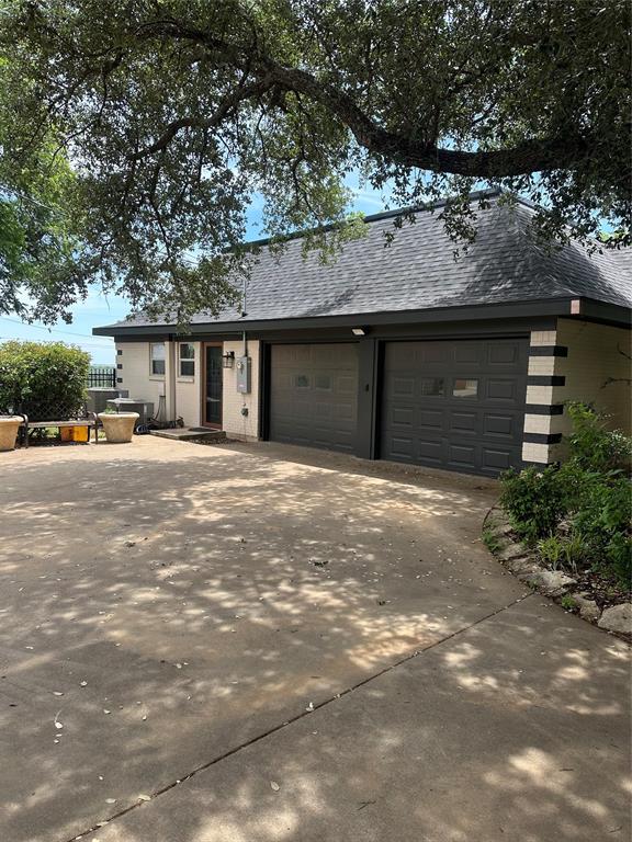 505 High Road Coleman, TX 76834 - Photo 5 of 38 a front view of a house with a yard and parking space