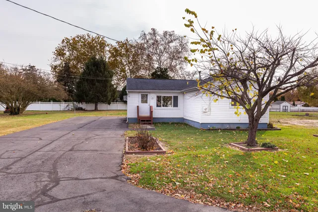 a view of a house with swimming pool and sitting area
