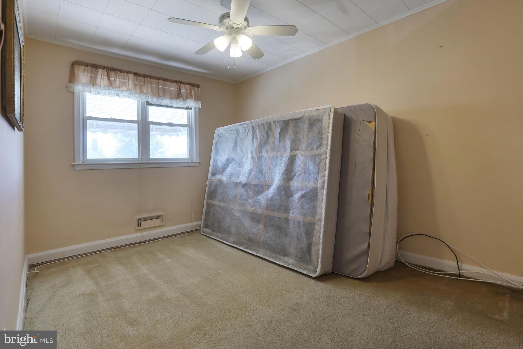 1892 Church Road Baltimore, MD 21222 - Photo 11 of 20 wooden floor in an empty room with a window