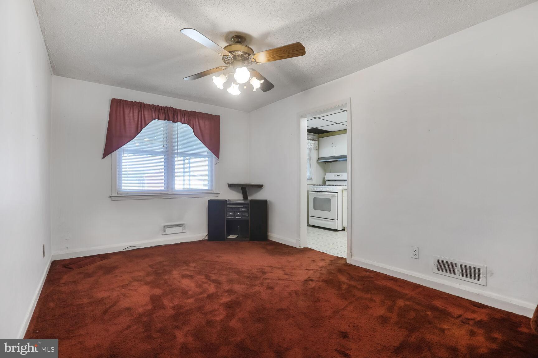 1892 Church Road Baltimore, MD 21222 - Photo 13 of 20 wooden floor in an empty room with a window