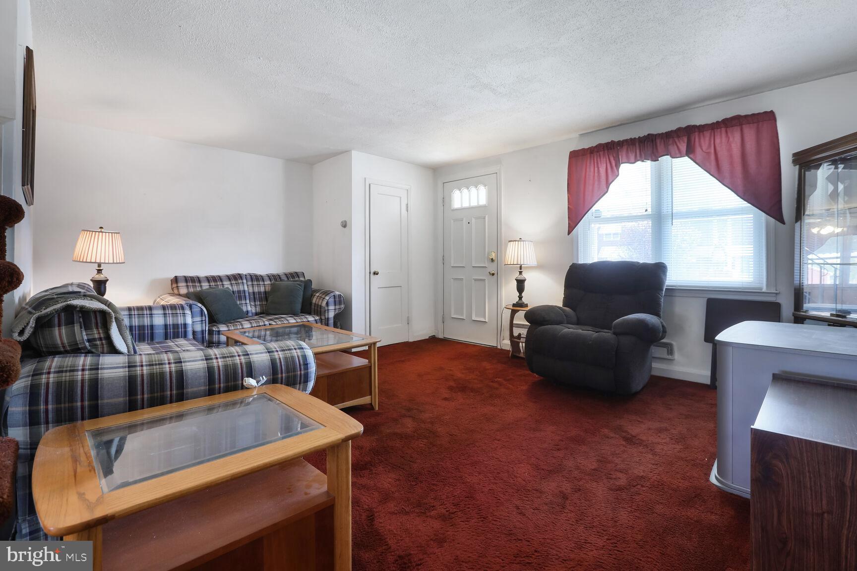 1892 Church Road Baltimore, MD 21222 - Photo 2 of 20 a living room with furniture and a large window