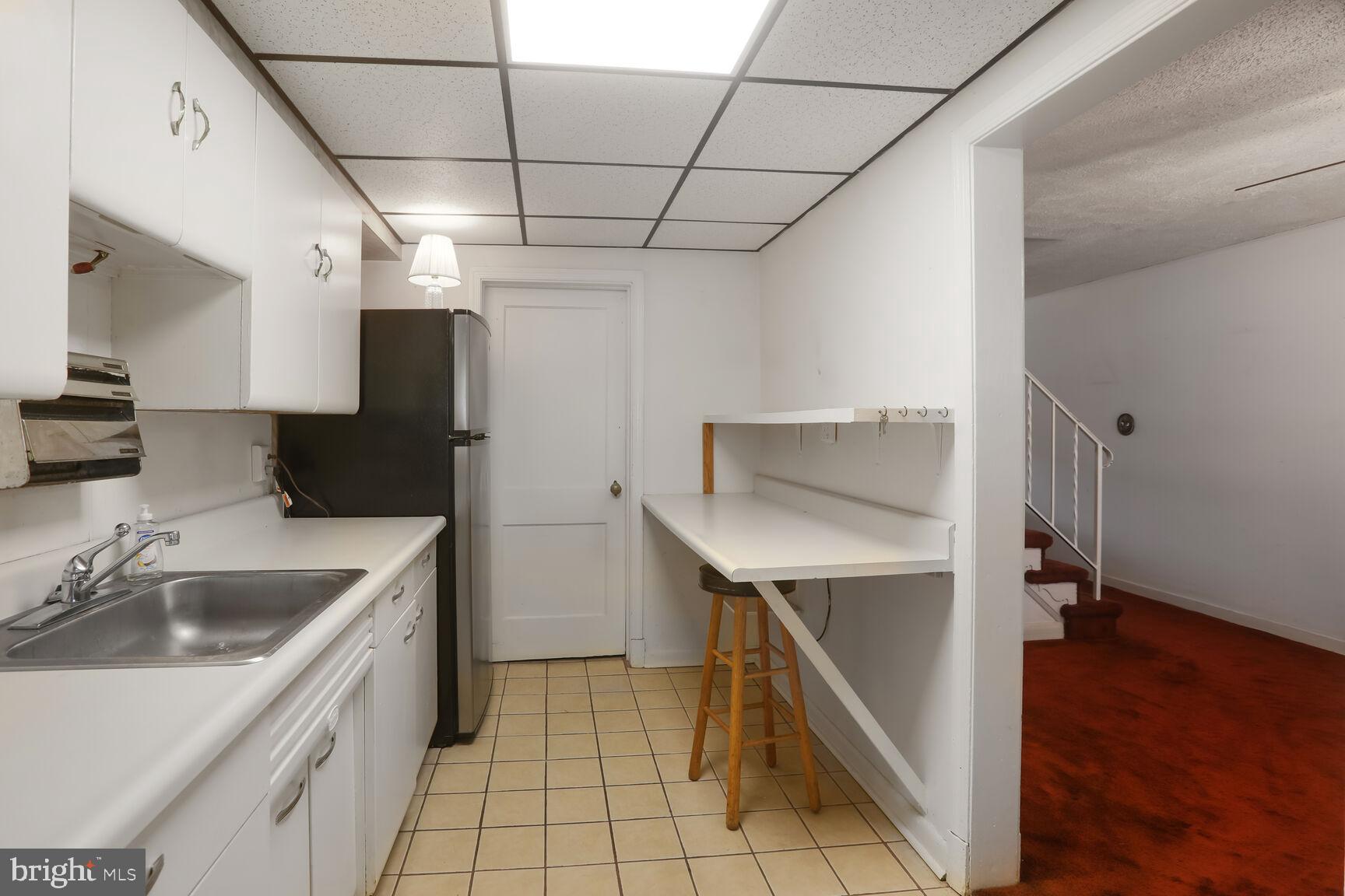 1892 Church Road Baltimore, MD 21222 - Photo 6 of 20 a kitchen with a sink cabinets and wooden floor