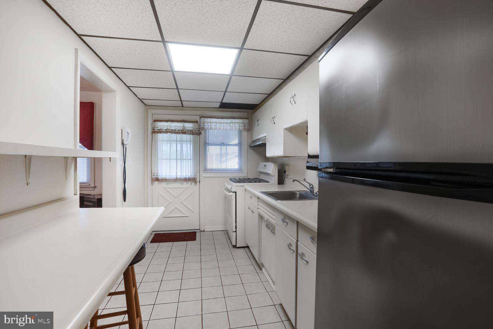 1892 Church Road Baltimore, MD 21222 - Photo 7 of 20 a kitchen with stainless steel appliances a sink stove and cabinets