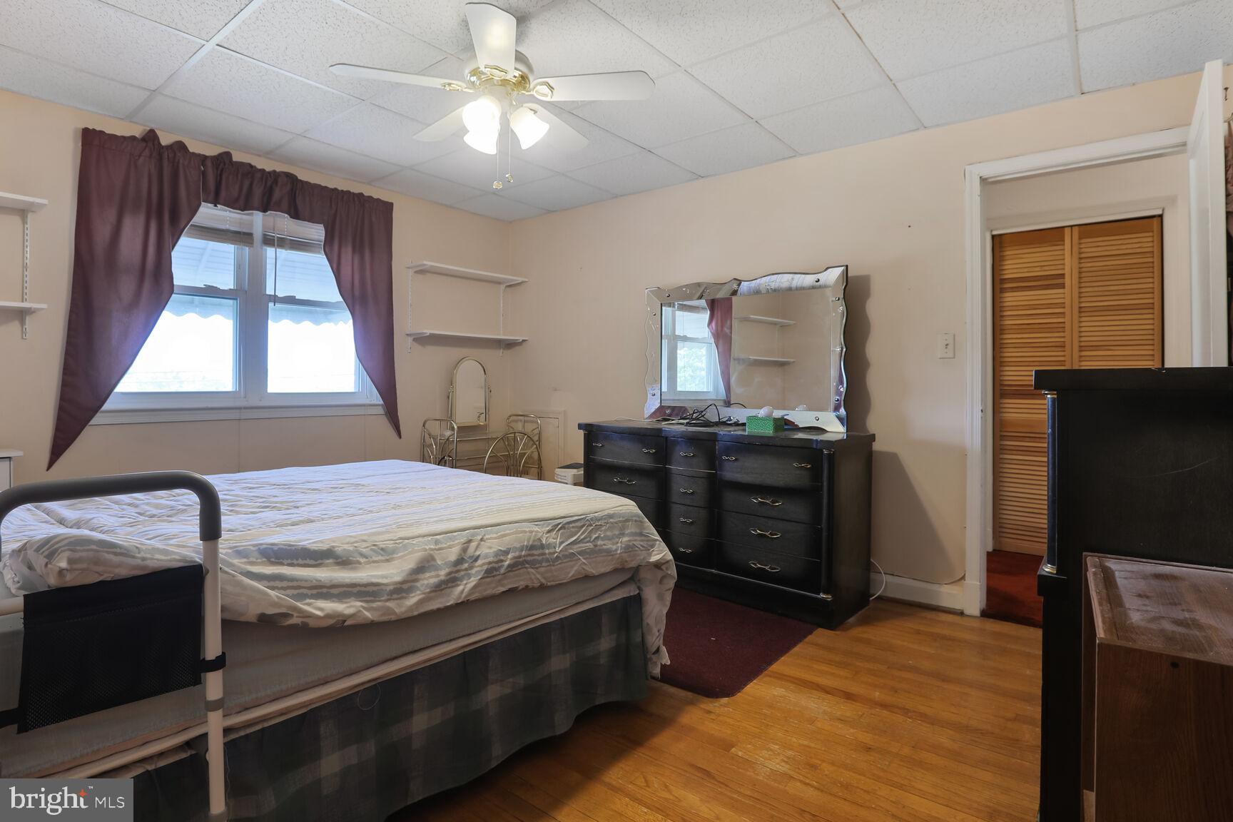 1892 Church Road Baltimore, MD 21222 - Photo 9 of 20 a bed room with a bed and a television