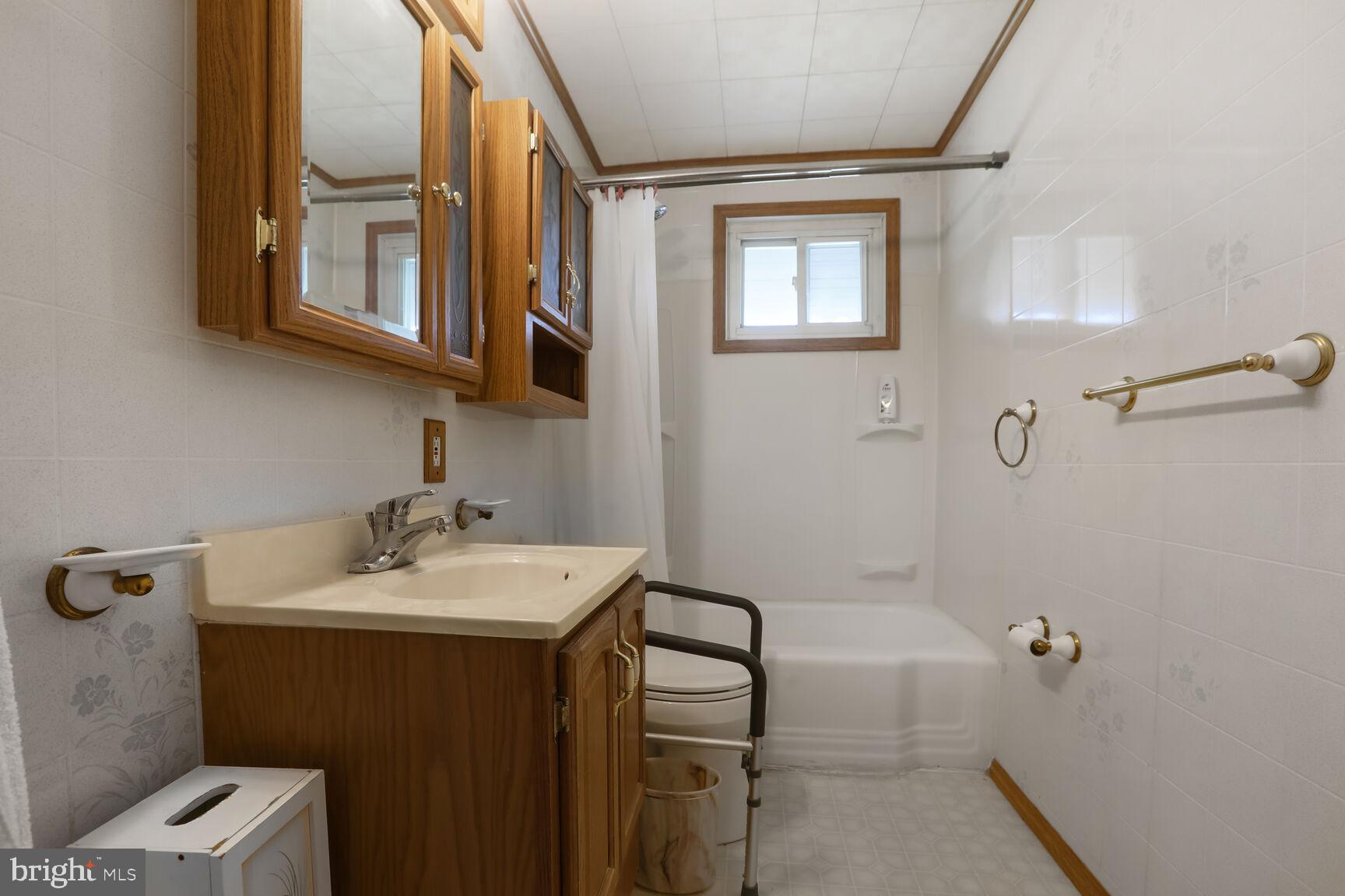 1892 Church Road Baltimore, MD 21222 - Photo 10 of 20 a bathroom with a sink and a mirror