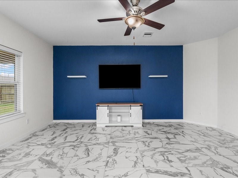9203 Waldrick Trace Drive Rosharon, TX 77583 - Photo 18 of 35 a view of a livingroom with a flat screen tv