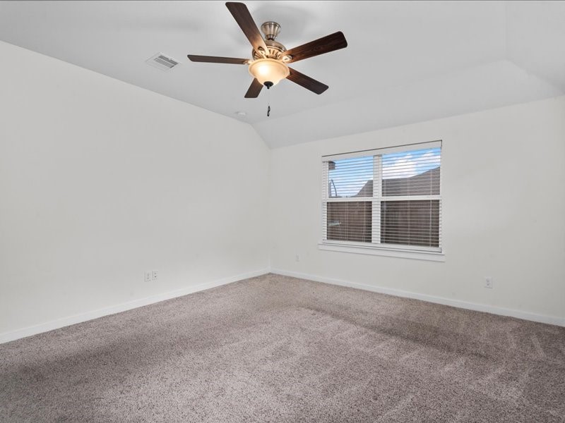 9203 Waldrick Trace Drive Rosharon, TX 77583 - Photo 24 of 35 en empty room with ceiling fan and window
