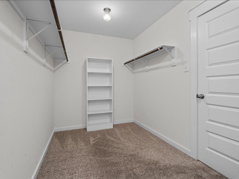 9203 Waldrick Trace Drive Rosharon, TX 77583 - Photo 28 of 35 a view of walk in closet with empty racks