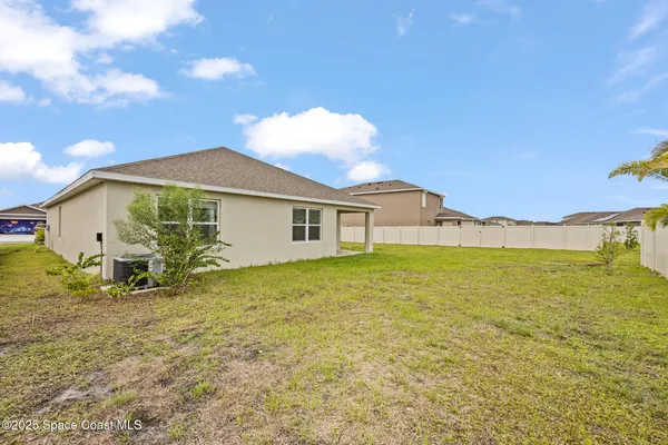 a view of a big room with windows and garden