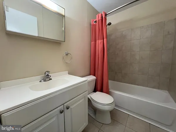 a bathroom with a sink a toilet and a bathtub