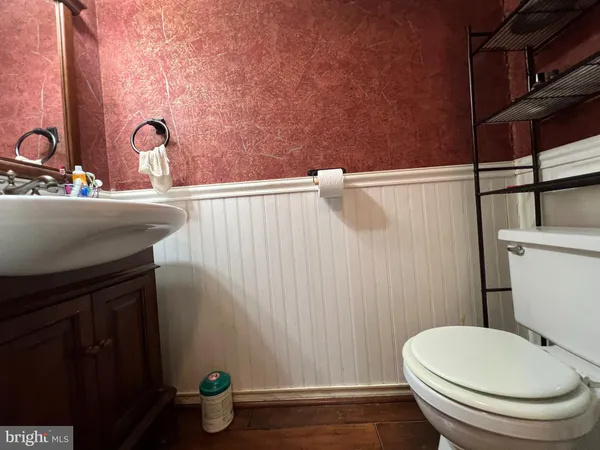a bathroom with a toilet and a sink