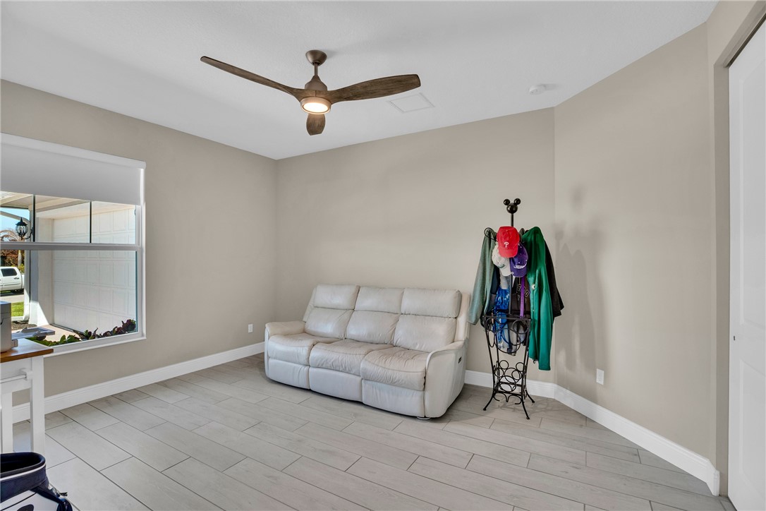 105 Night Hawk Way Sebastian, FL 32958 - Photo 27 of 36 a living room with furniture and a wooden floor