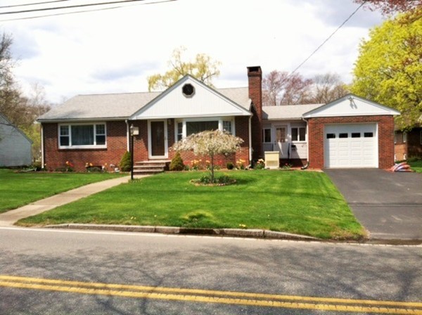 106 Mishawum Road Woburn, MA 01801 - Photo 1 of 23 a front view of a house with garden