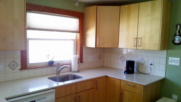 106 Mishawum Road Woburn, MA 01801 - Photo 12 of 23 a kitchen with a sink and a window