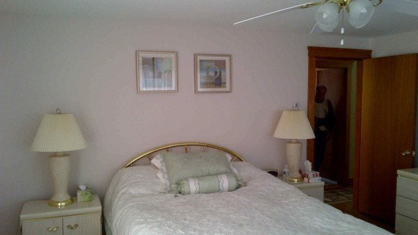 106 Mishawum Road Woburn, MA 01801 - Photo 14 of 23 a room with a bed and a table