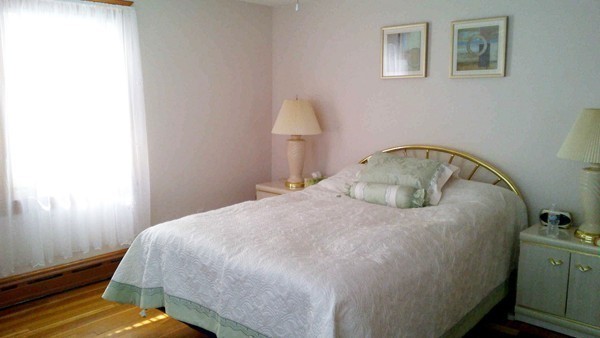 106 Mishawum Road Woburn, MA 01801 - Photo 16 of 23 a bedroom with a bed and a window