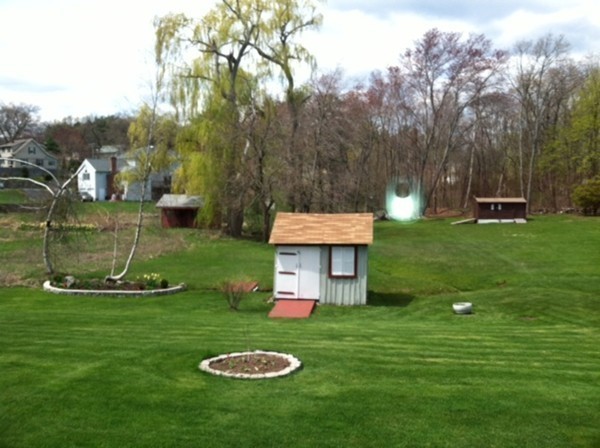 106 Mishawum Road Woburn, MA 01801 - Photo 23 of 23 a view of a table and chairs in the garden