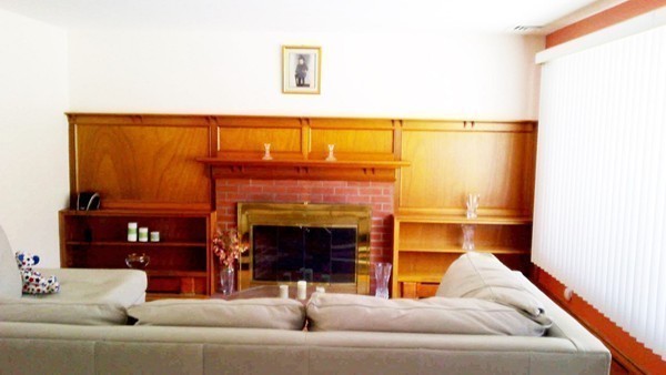 106 Mishawum Road Woburn, MA 01801 - Photo 5 of 23 a living room with furniture and a fireplace