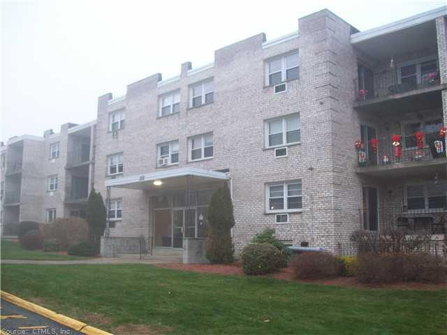 a front view of a building with garden