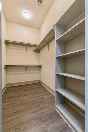 a view of an empty walk in closet