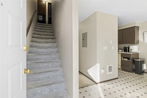 a view of a workspace with furniture