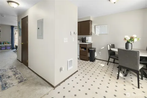 a kitchen with a white cabinets and white appliances