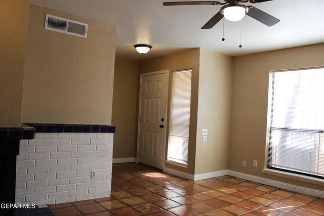 a kitchen with kitchen island a stove and a refrigerator