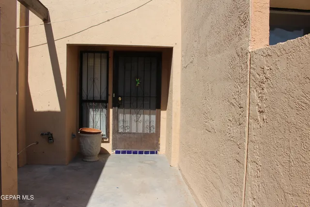a view of an empty room and wooden floor