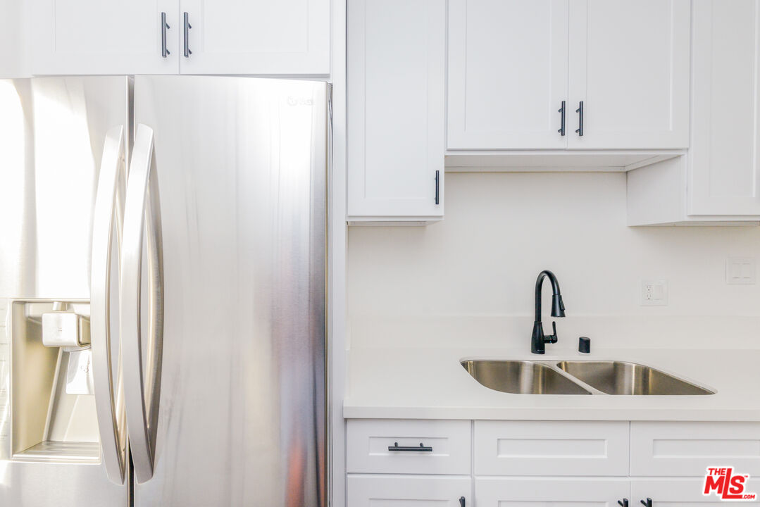 2107 Pullman Lane, Unit A Redondo Beach, CA 90278 - Photo 14 of 42 a kitchen with a sink and a refrigerator
