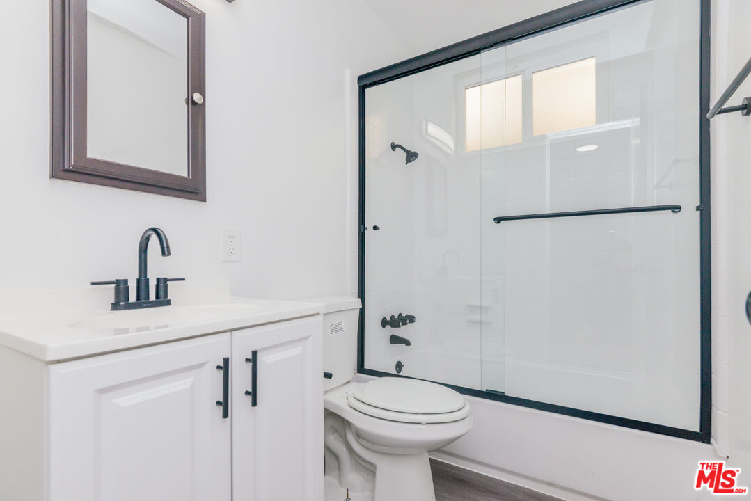 2107 Pullman Lane, Unit A Redondo Beach, CA 90278 - Photo 17 of 42 a bathroom with a sink a toilet and shower