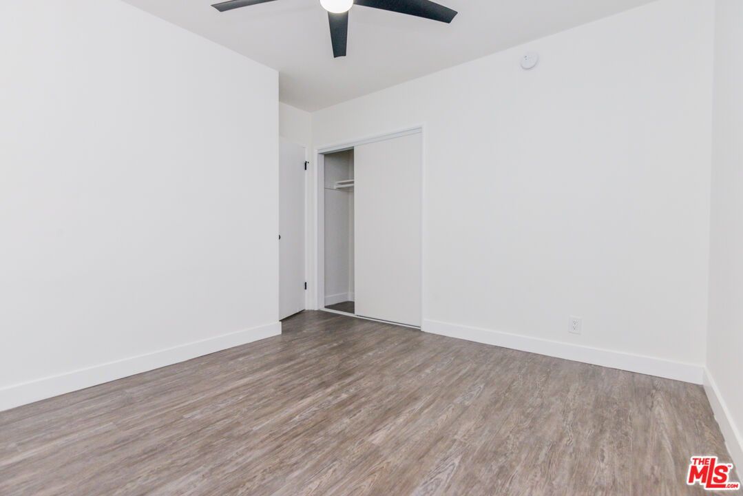 2107 Pullman Lane, Unit A Redondo Beach, CA 90278 - Photo 21 of 42 a view of an empty room with wooden floor