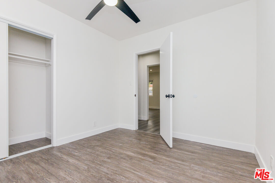 2107 Pullman Lane, Unit A Redondo Beach, CA 90278 - Photo 27 of 42 an empty room with wooden floor and window