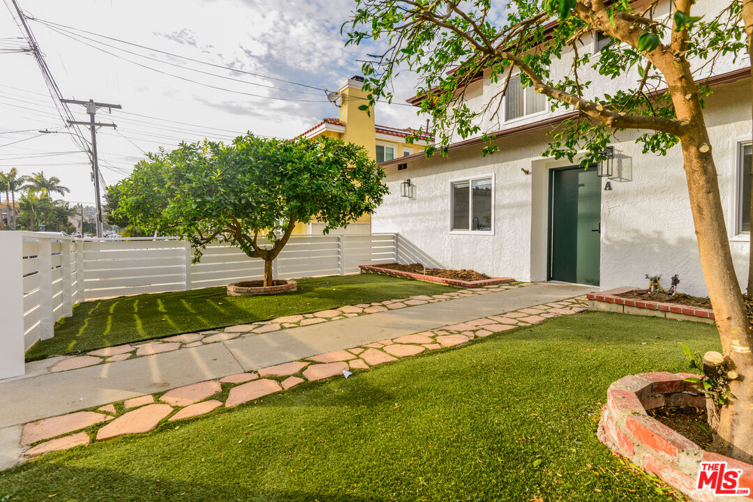 2107 Pullman Lane, Unit A Redondo Beach, CA 90278 - Photo 3 of 42 a view of a house with a yard