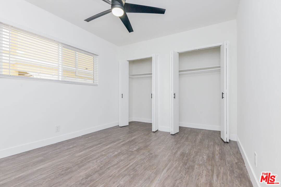 2107 Pullman Lane, Unit A Redondo Beach, CA 90278 - Photo 37 of 42 a view of empty room with wooden floor and window