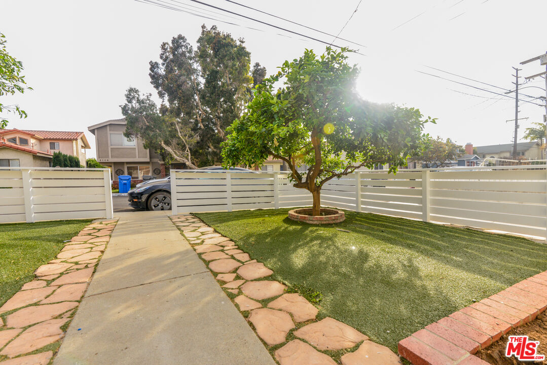 2107 Pullman Lane, Unit A Redondo Beach, CA 90278 - Photo 4 of 42 a view of a yard with swimming pool