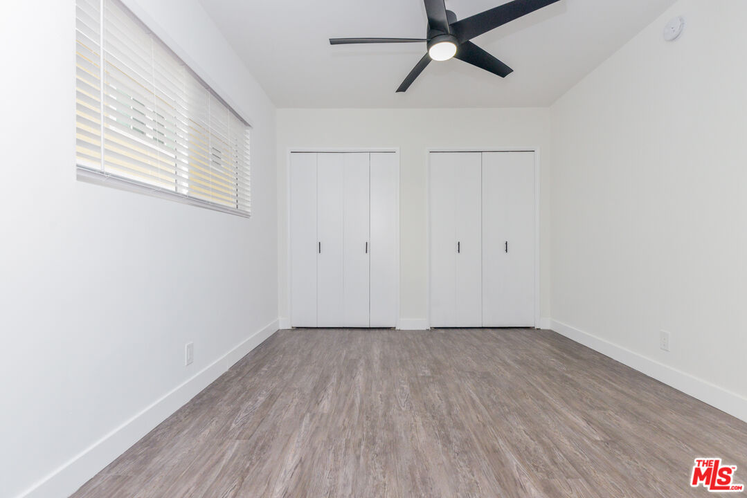 2107 Pullman Lane, Unit A Redondo Beach, CA 90278 - Photo 42 of 42 a view of a room with wooden floor and white walls
