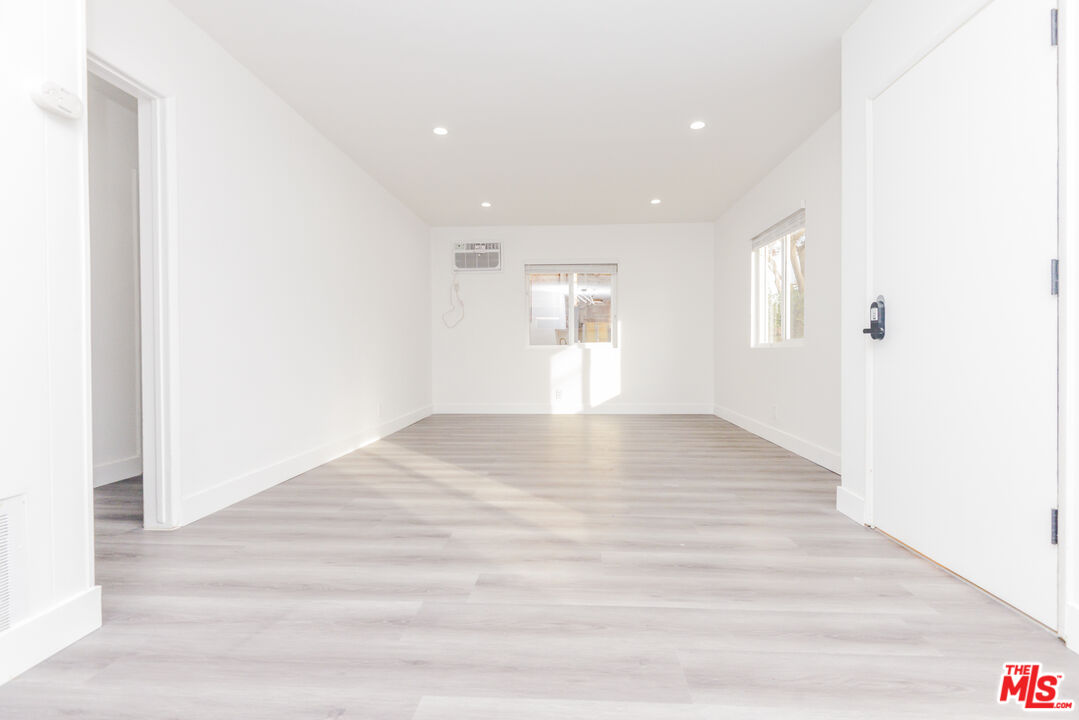 2107 Pullman Lane, Unit A Redondo Beach, CA 90278 - Photo 6 of 42 a view of empty room with wooden floor
