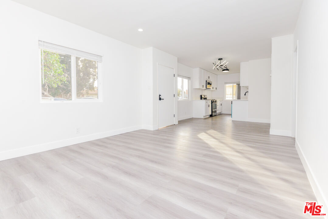2107 Pullman Lane, Unit A Redondo Beach, CA 90278 - Photo 7 of 42 a view of empty room with wooden floor