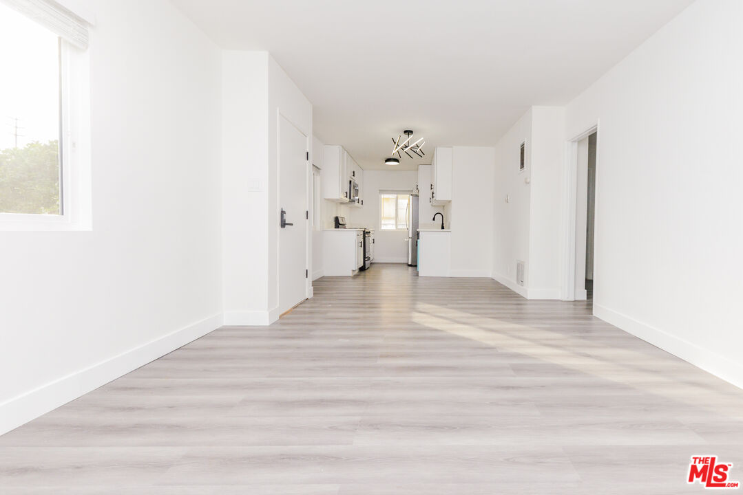 2107 Pullman Lane, Unit A Redondo Beach, CA 90278 - Photo 9 of 42 a view of empty room with wooden floor
