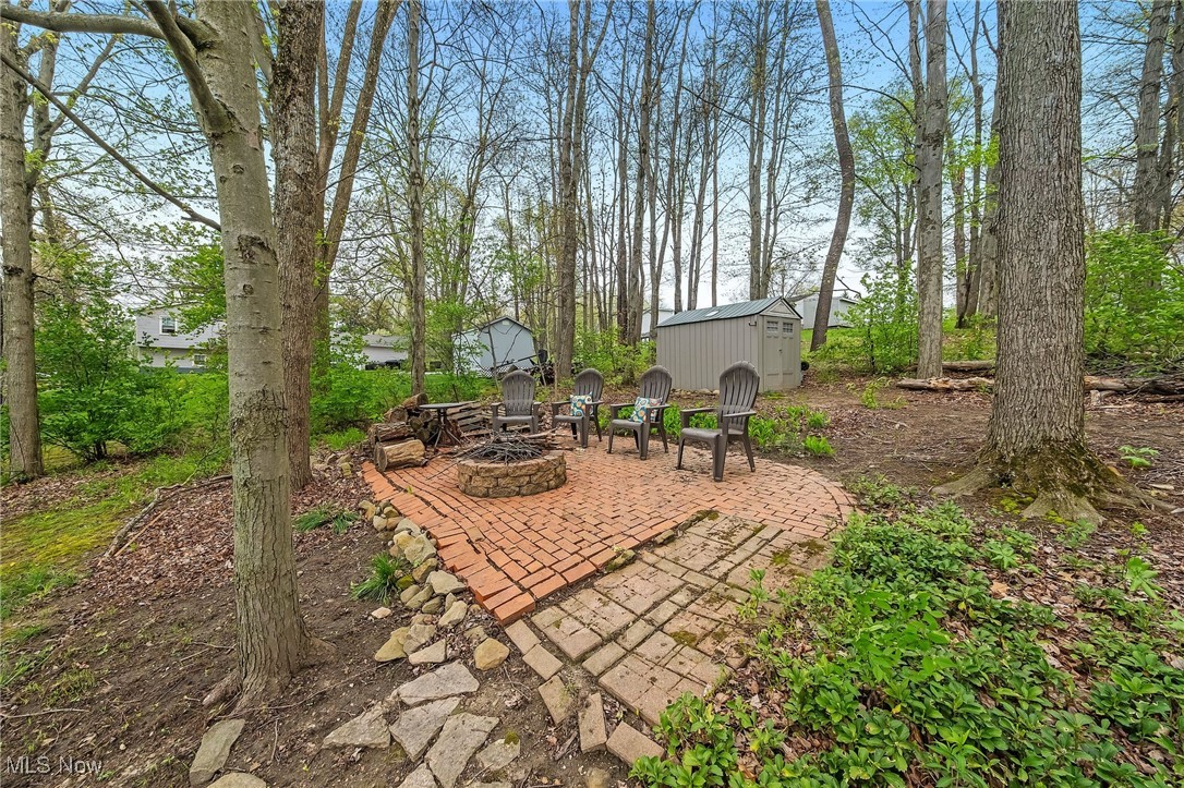 1247 Derbydale Road Akron, OH 44306 - Photo 36 of 45 View of patio with an storage shed & a fire pit
