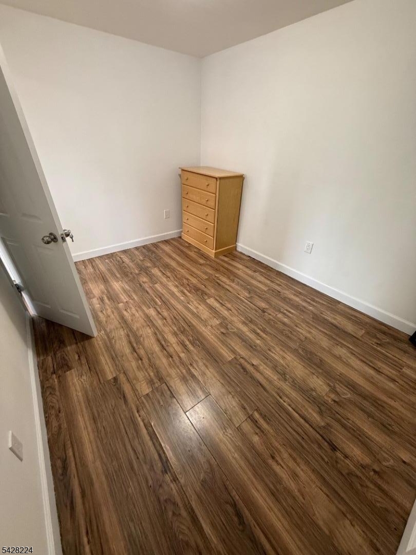 182 Ferry Street, Unit 2F Newark, NJ 07105 - Photo 8 of 14 a view of a room with wooden floor