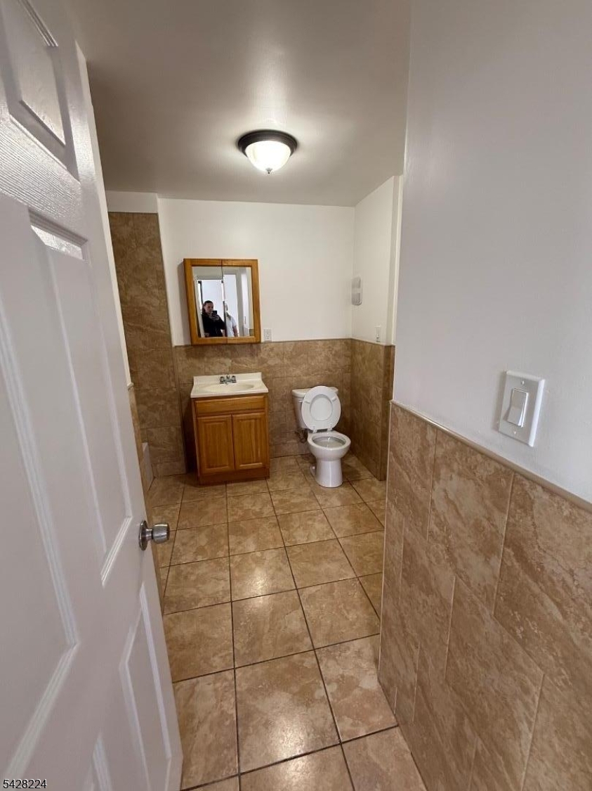 182 Ferry Street, Unit 2F Newark, NJ 07105 - Photo 10 of 14 a bathroom with a sink and a mirror