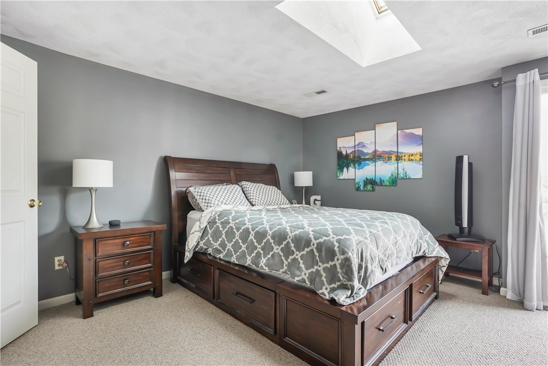 161 West Shore Road, Unit C4 Warwick, RI 02889 - Photo 12 of 14 Master Bedroom offers tons of natural light with skylight & Juliette balcony